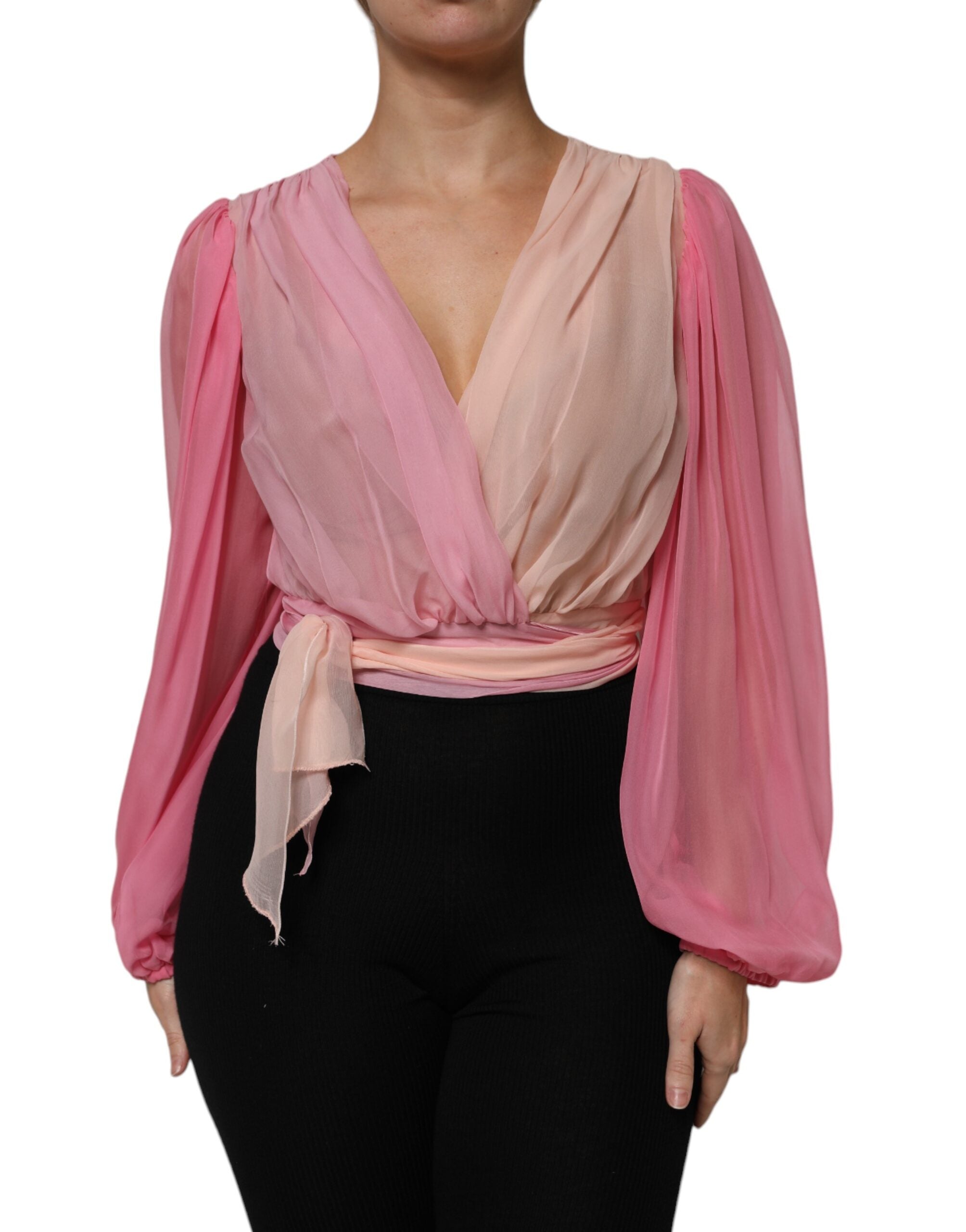 Blouse longue à manches longues rose Dolce & Gabbana avec décolleté en V plongeant, style élégant et sophistiqué.