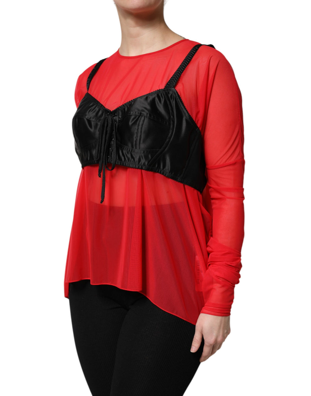 Haut Dolce & Gabbana en rouge et noir, bustier avec détails, manches longues et style élégant visible sur l'image.