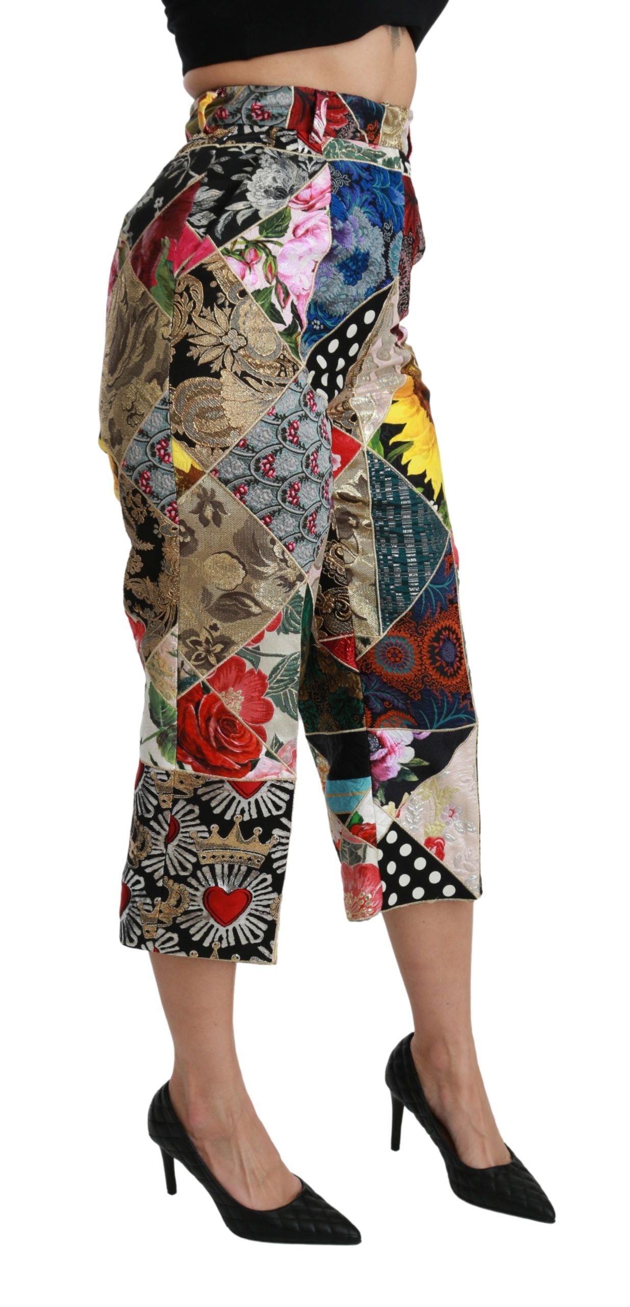 Pantalons cropped en soie Dolce & Gabbana à taille haute avec imprimé multicolore, vue de face.