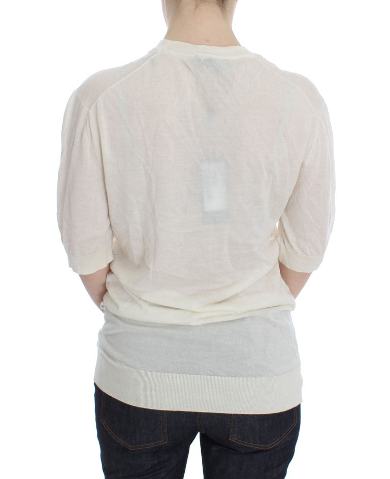 Pull blanc en cachemire à 100 % de Dolce & Gabbana, doux et élégant, visible avec détails de finition.