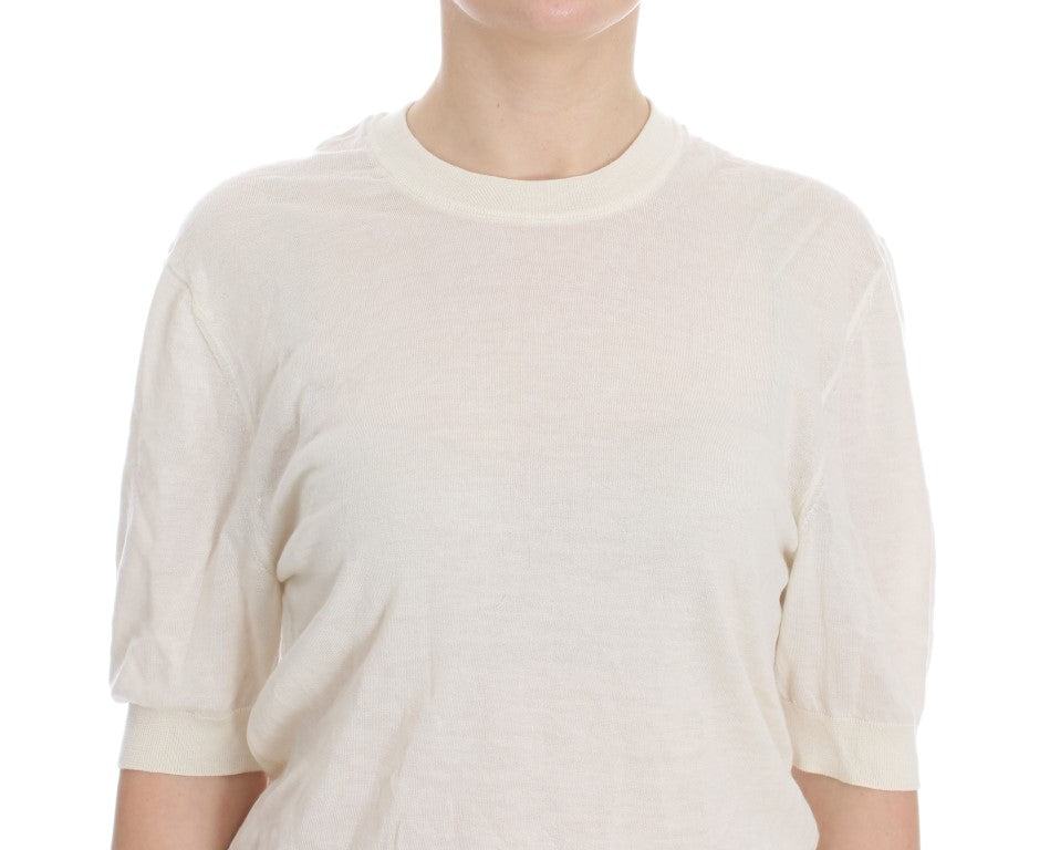 Pull blanc en cachemire Dolce & Gabbana, doux et élégant, avec col rond et finition soignée, pour un style chic et confortable.