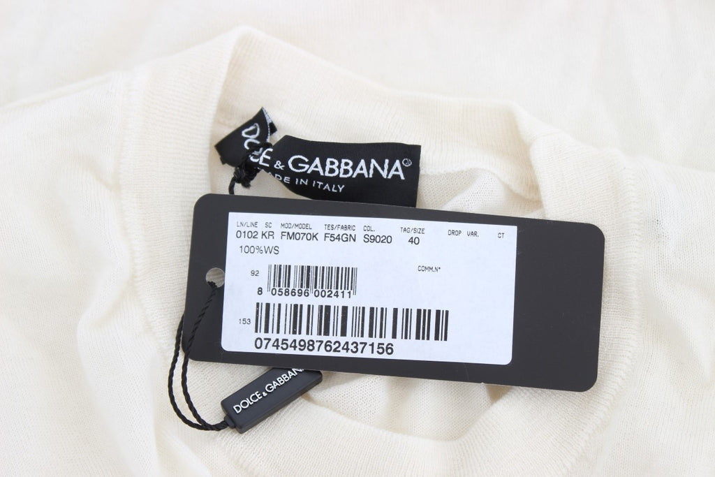 Pull blanc en cachemire à 100% de Dolce & Gabbana, douceur et élégance pour un style sophistiqué.