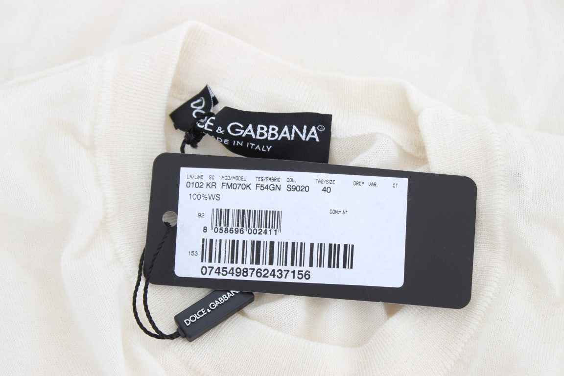 Pull blanc en cachemire à 100% de Dolce & Gabbana, douceur et élégance pour un style sophistiqué.