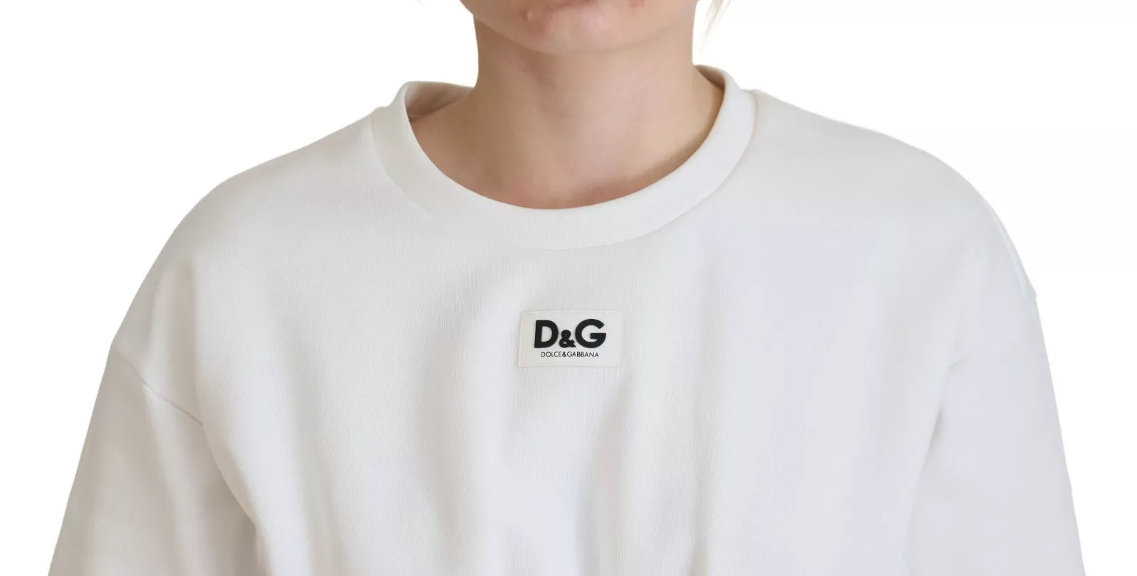 Haut blanc en coton extensible de type corset Dolce & Gabbana, ajusté et élégant, porté comme t-shirt.