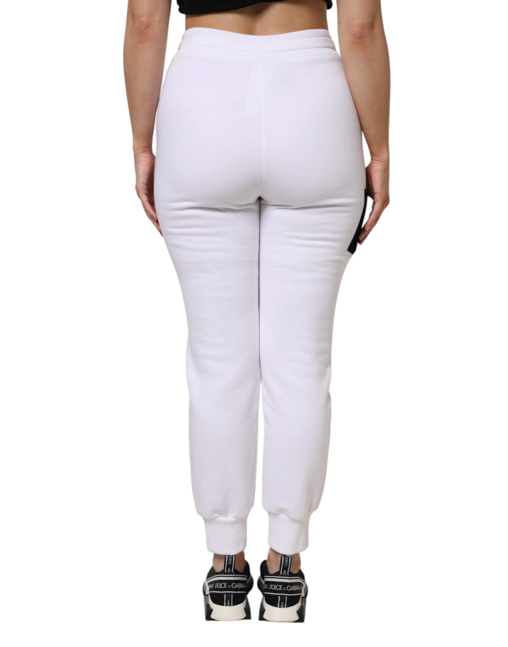 Pantalon de jogging Dolce & Gabbana en coton blanc stretch, style décontracté, avec ceinture élastique et poches latérales.
