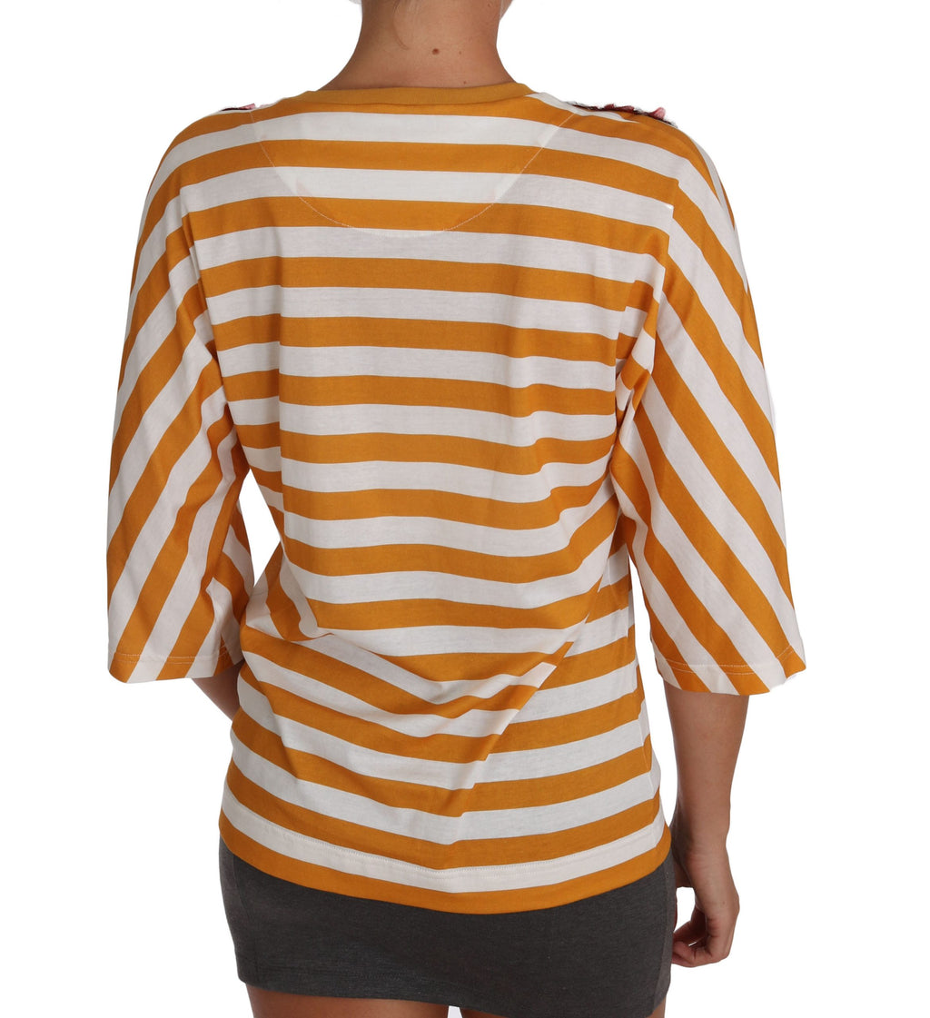 T-shirt blanc Dolce & Gabbana FIRENZE avec motif orange, en coton, porté sur mannequin, vue de face.
