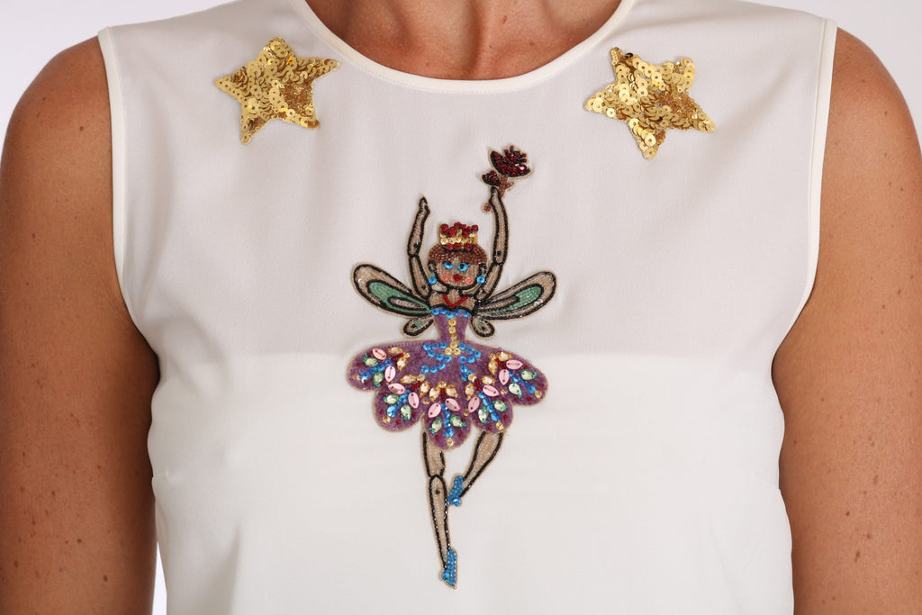 Top en soie blanche Dolce & Gabbana avec embellissements de cristaux et sequins, style féerique et élégant.