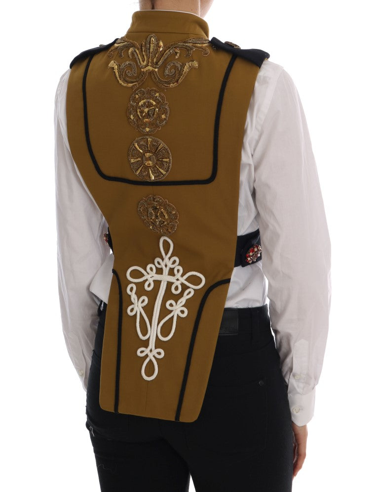 Veste sans manches Dolce & Gabbana jaune avec croix en cristal, style vest et détails élégants.