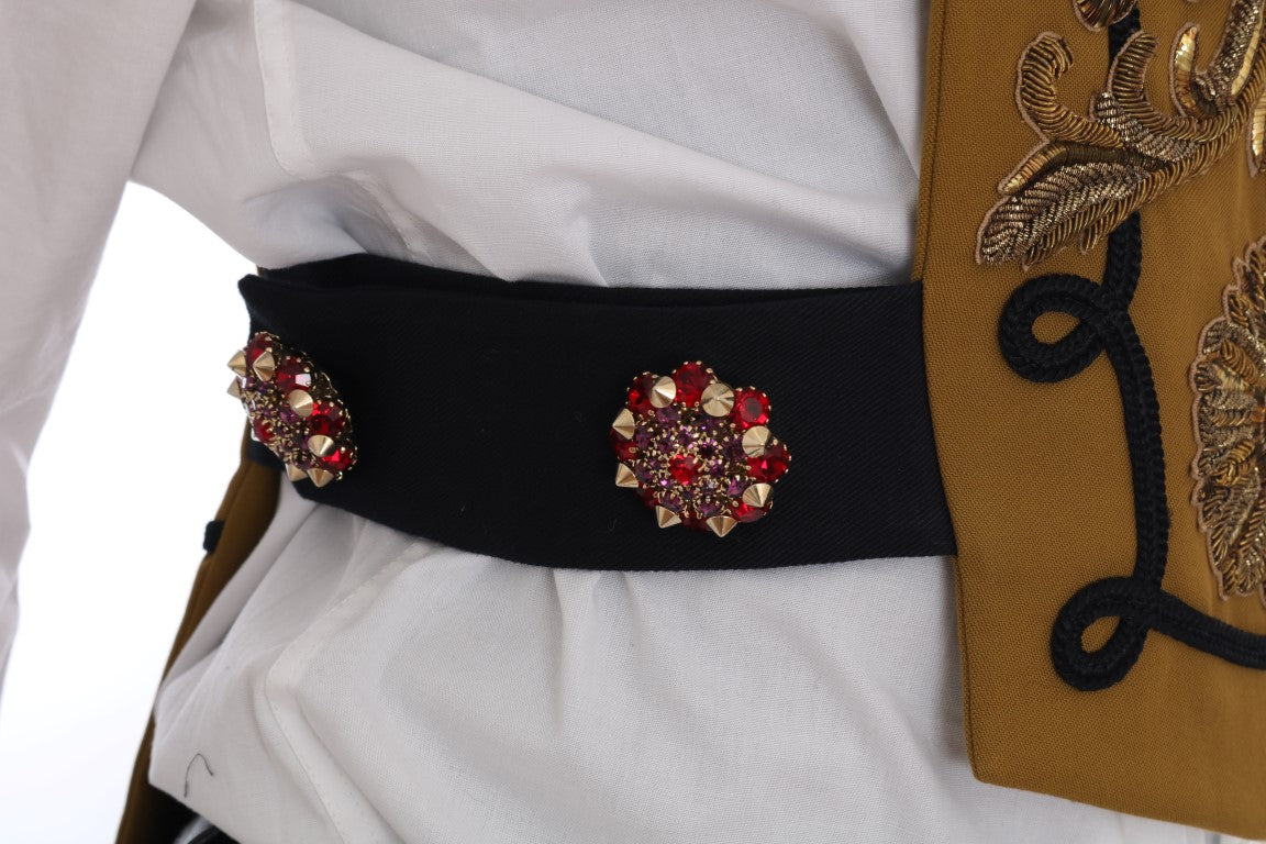 Veste sans manches Dolce & Gabbana jaune avec croix en cristal, style vest, détail élégant et brillant visible sur l'image.