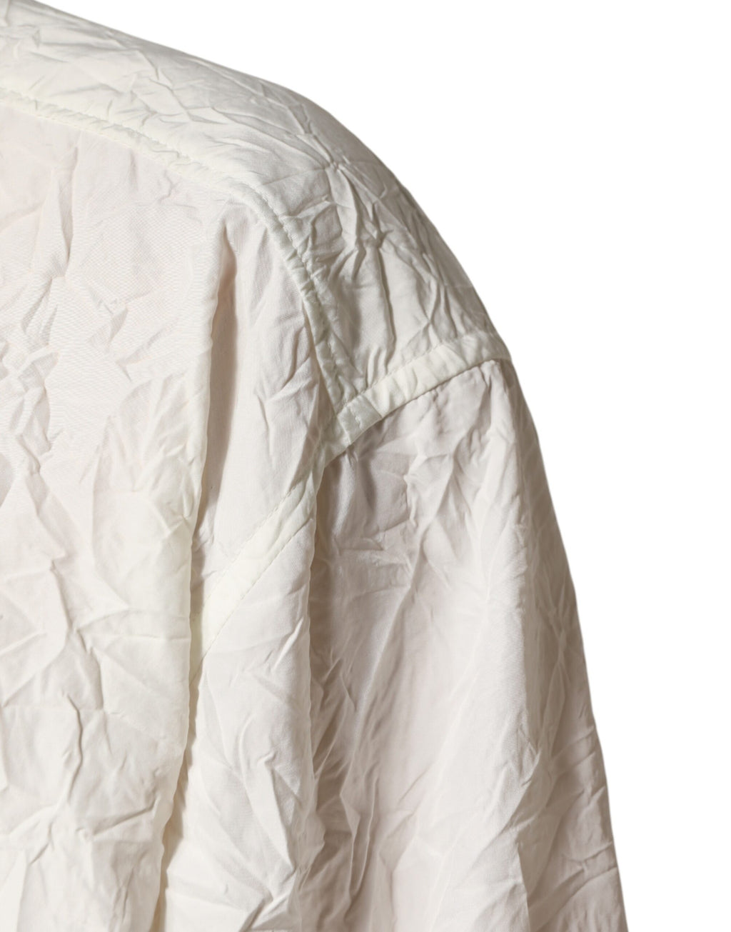 Chemise homme en coton blanc Dolce & Gabbana à manches longues, style élégant et classique, visible en détail dans l’image.