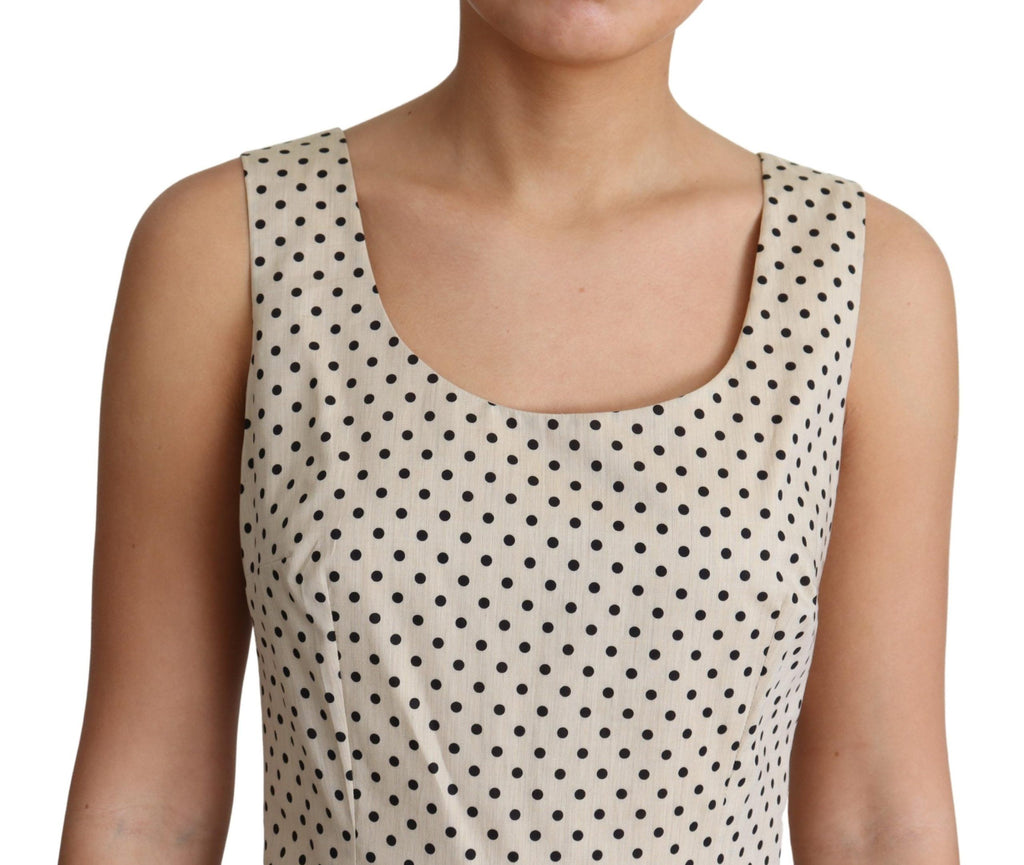 Robe beige à pois en coton Dolce & Gabbana, coupe évasée et élégante, avec motif à pois sur toute la robe.
