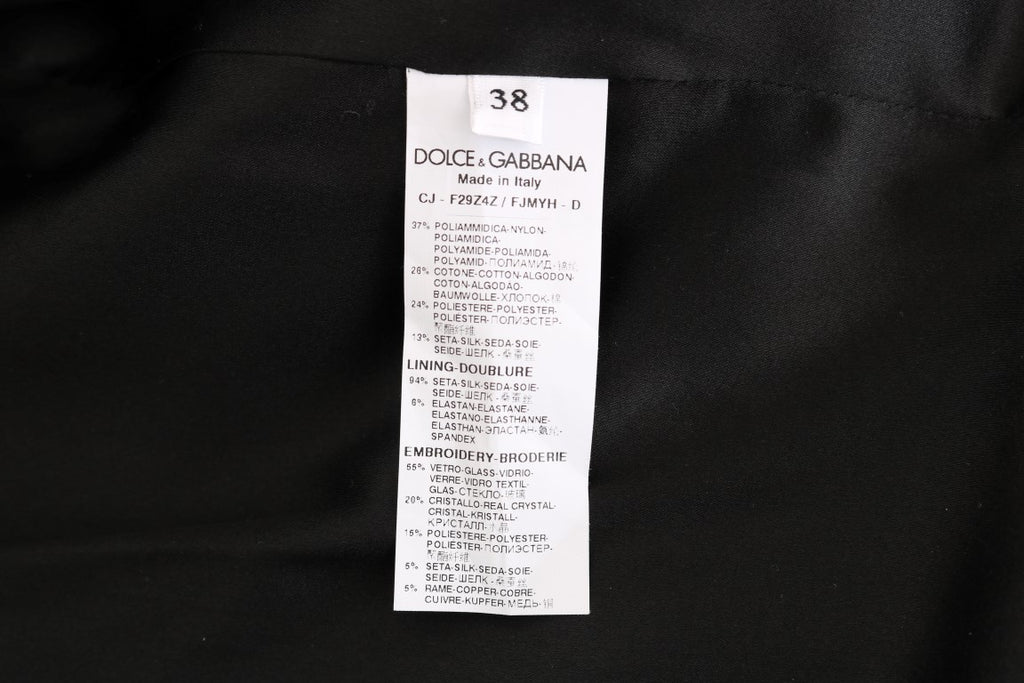 Veste blazer en brocart noir Dolce & Gabbana avec détails élégants et coupe sophistiquée, vue de face sur fond neutre.