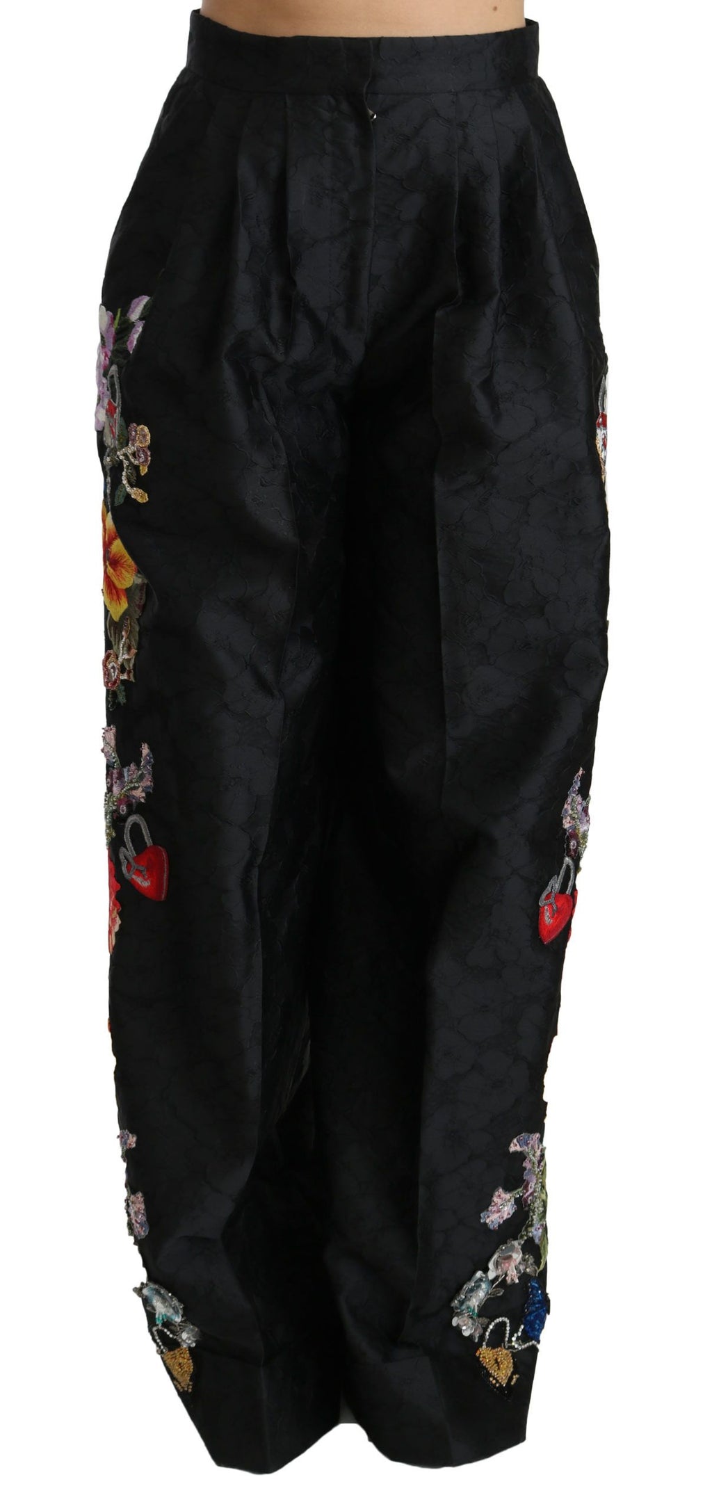 Pantalons noirs en brocart floral avec sequins et perles de Dolce & Gabbana, détails élégants et sophistiqués.
