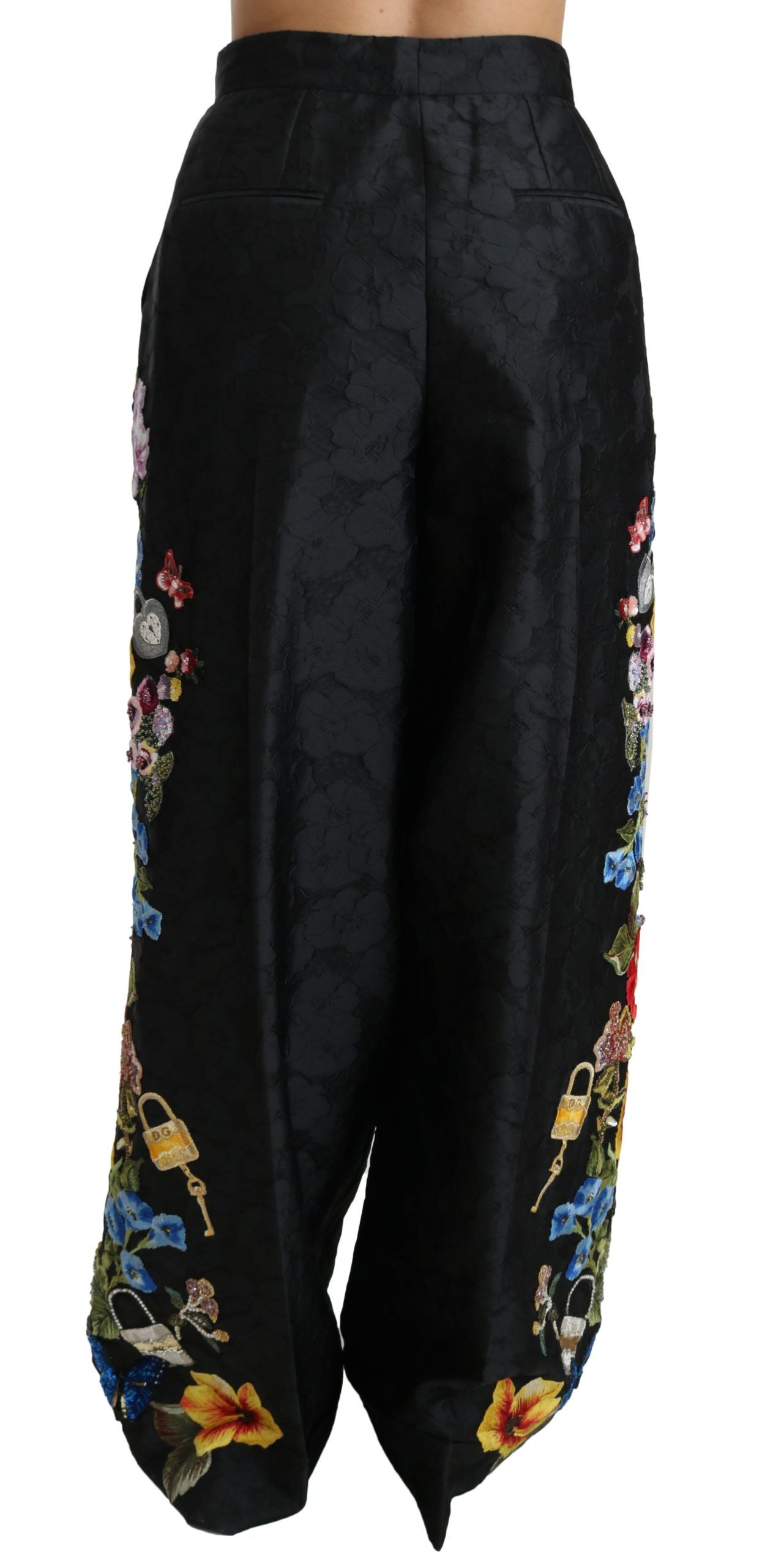 Pantalon noir brocart floral avec sequins et perles Dolce & Gabbana, détails élégants et finition sophistiquée.