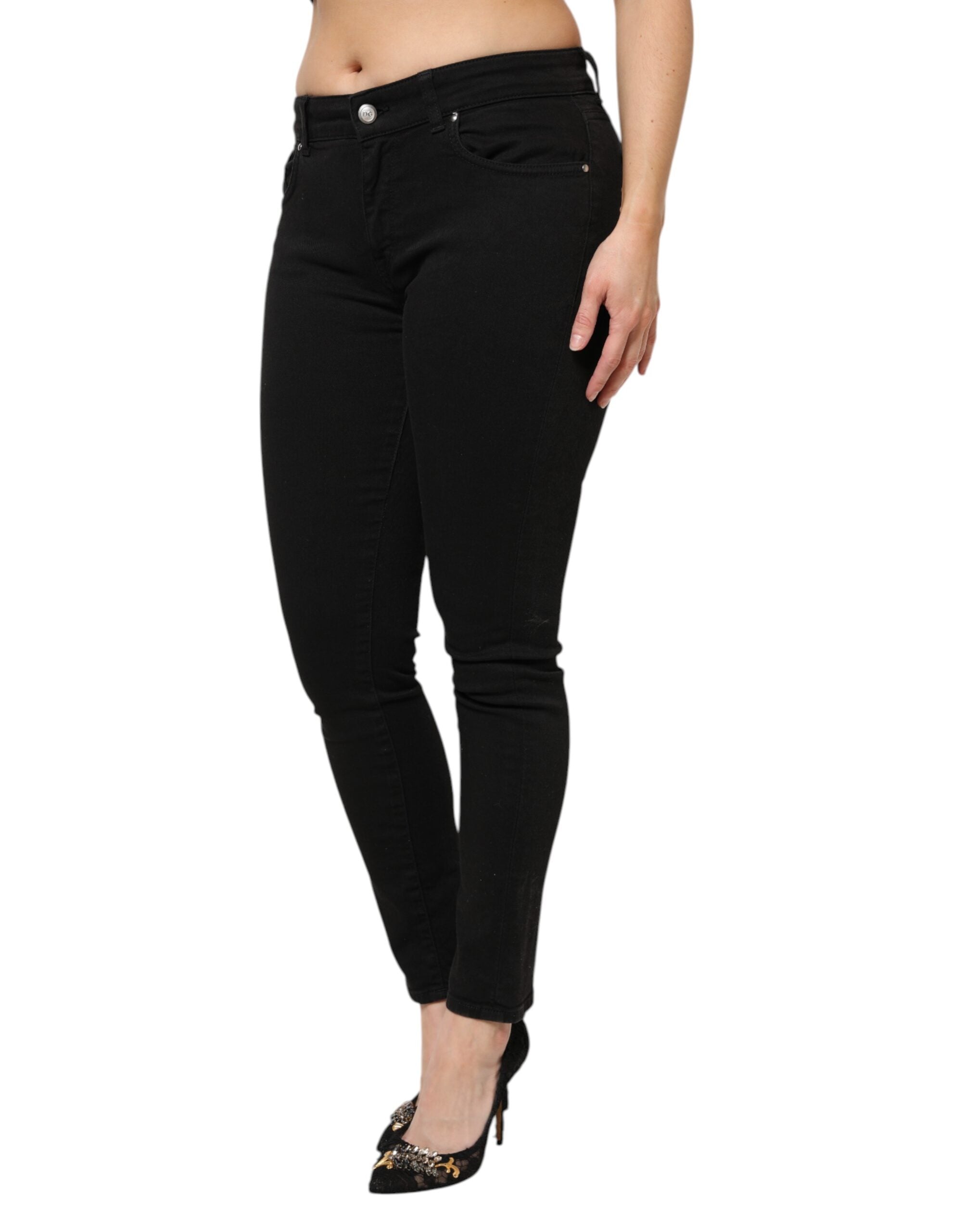 Jeans en denim noir Dolce & Gabbana, taille mi-haute, coupe classique, visibles en détail sur l'image.