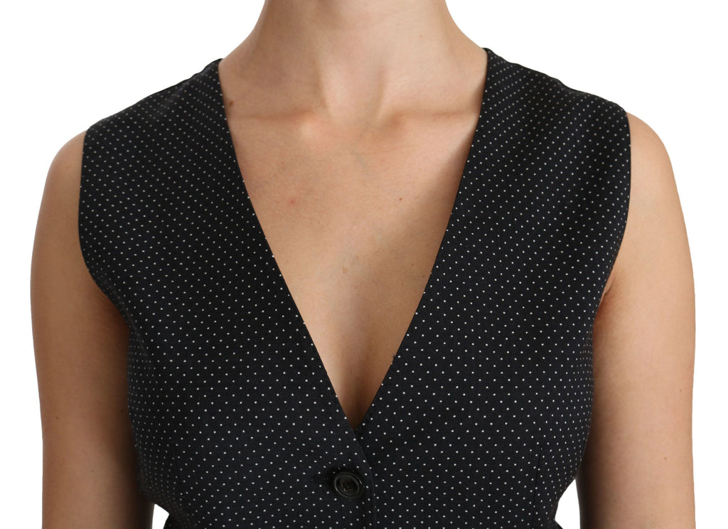 Veste blouse noire à pois Dolce & Gabbana, gilet cintré avec détails élégants, vue de face sur mannequin.