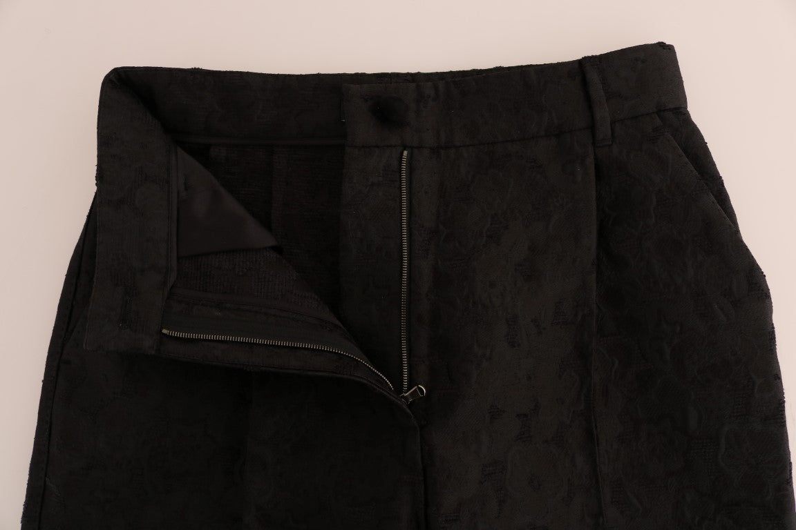 Pantalons Capri en brocart floral noir de Dolce & Gabbana, style élégant et sophistiqué, détails en tissu riche et broderie.