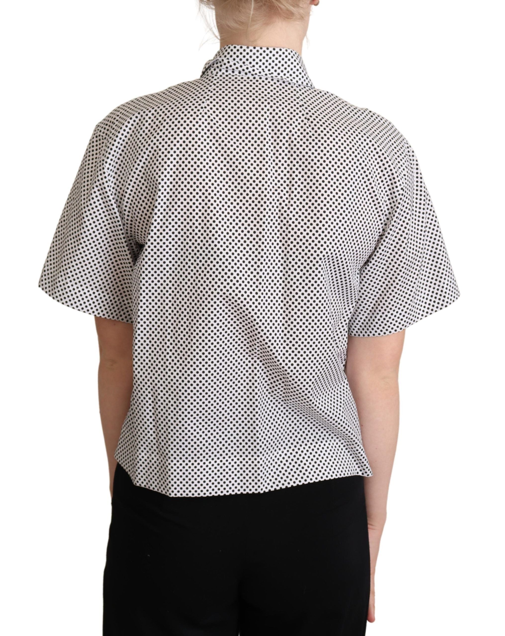 Chemise noire à pois blancs Dolce & Gabbana avec col, vue de face, tissu élégant et détails classiques.