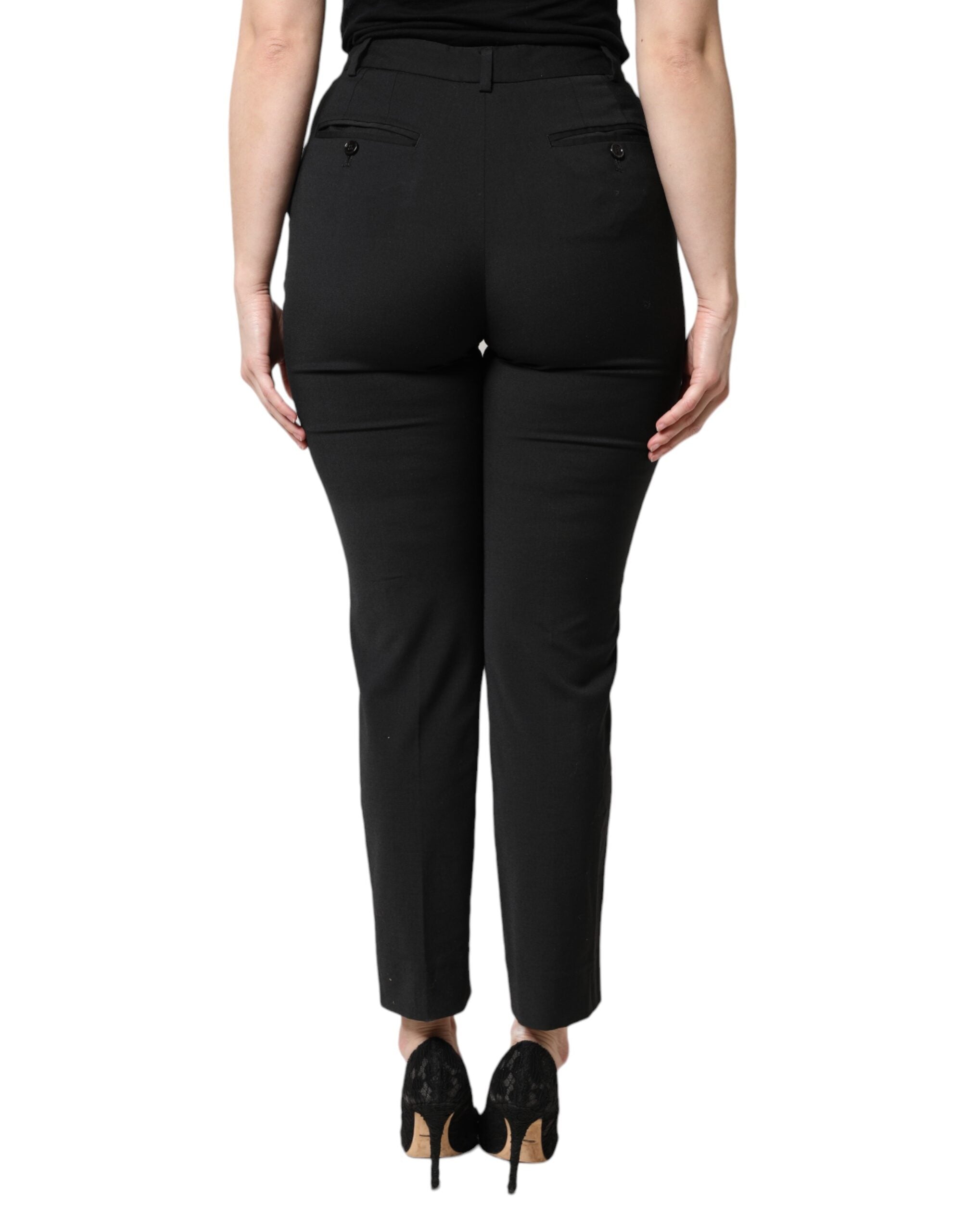 Pantalon noir en polyester Dolce & Gabbana à taille haute et coupe slim, vue de face.