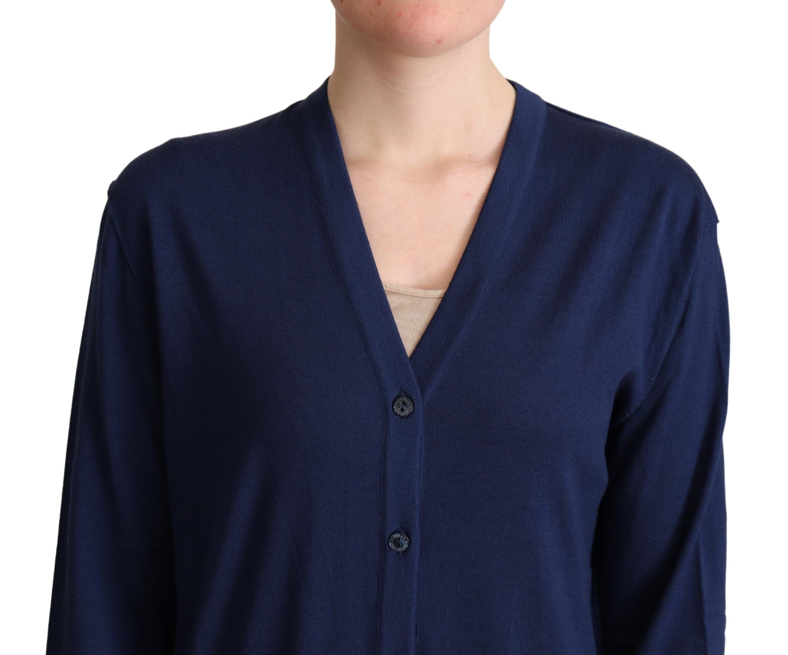 Pull en laine vierge bleu Dolce & Gabbana à boutons, cardigan élégant avec col classique et détails raffinés.