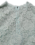 Robe sans manches en dentelle vert menthe de Dolce & Gabbana, longueur genoux, élégante et raffinée.