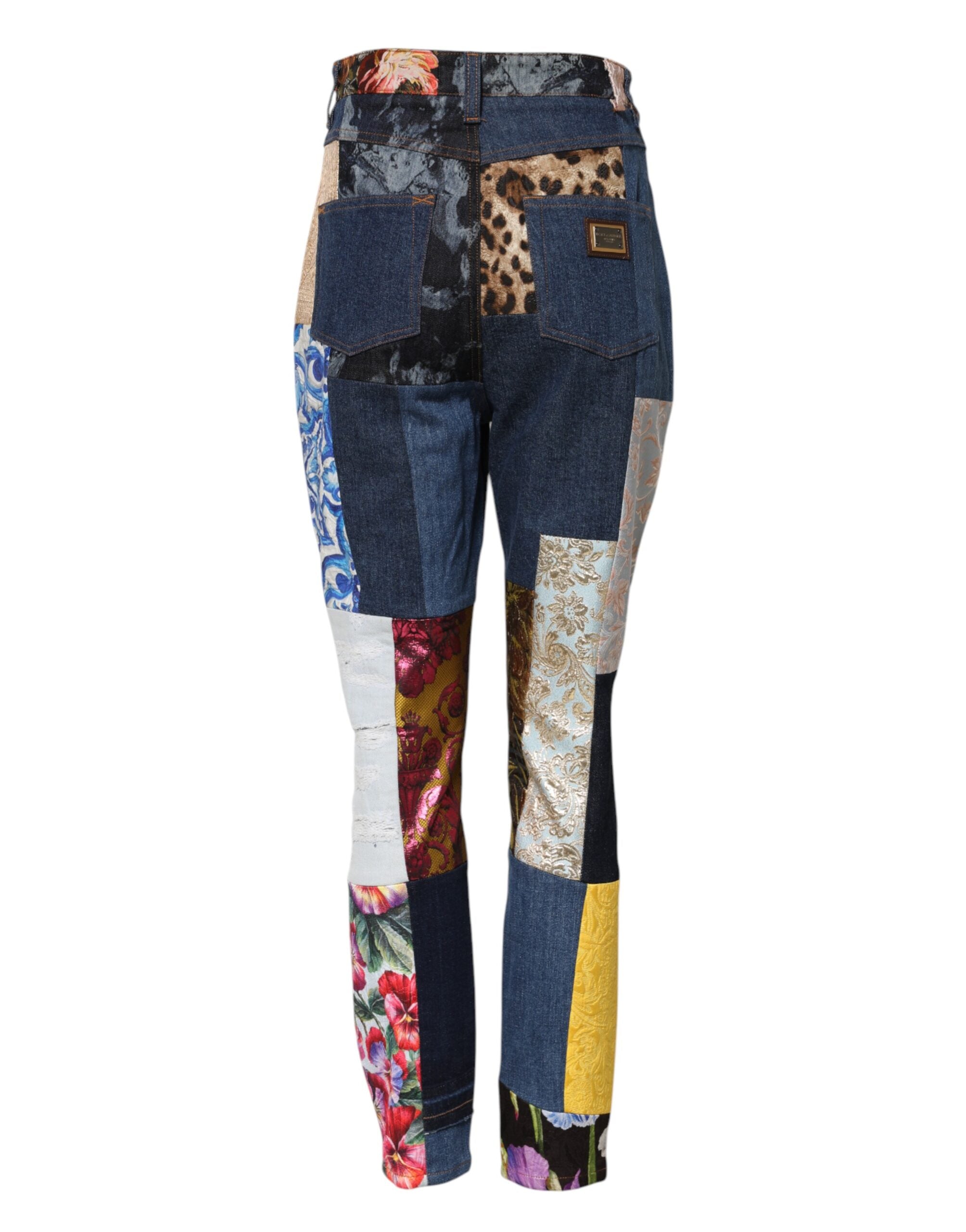 Jeans skinny en denim Dolce & Gabbana à patchworks multicolores avec détails de couture visibles.