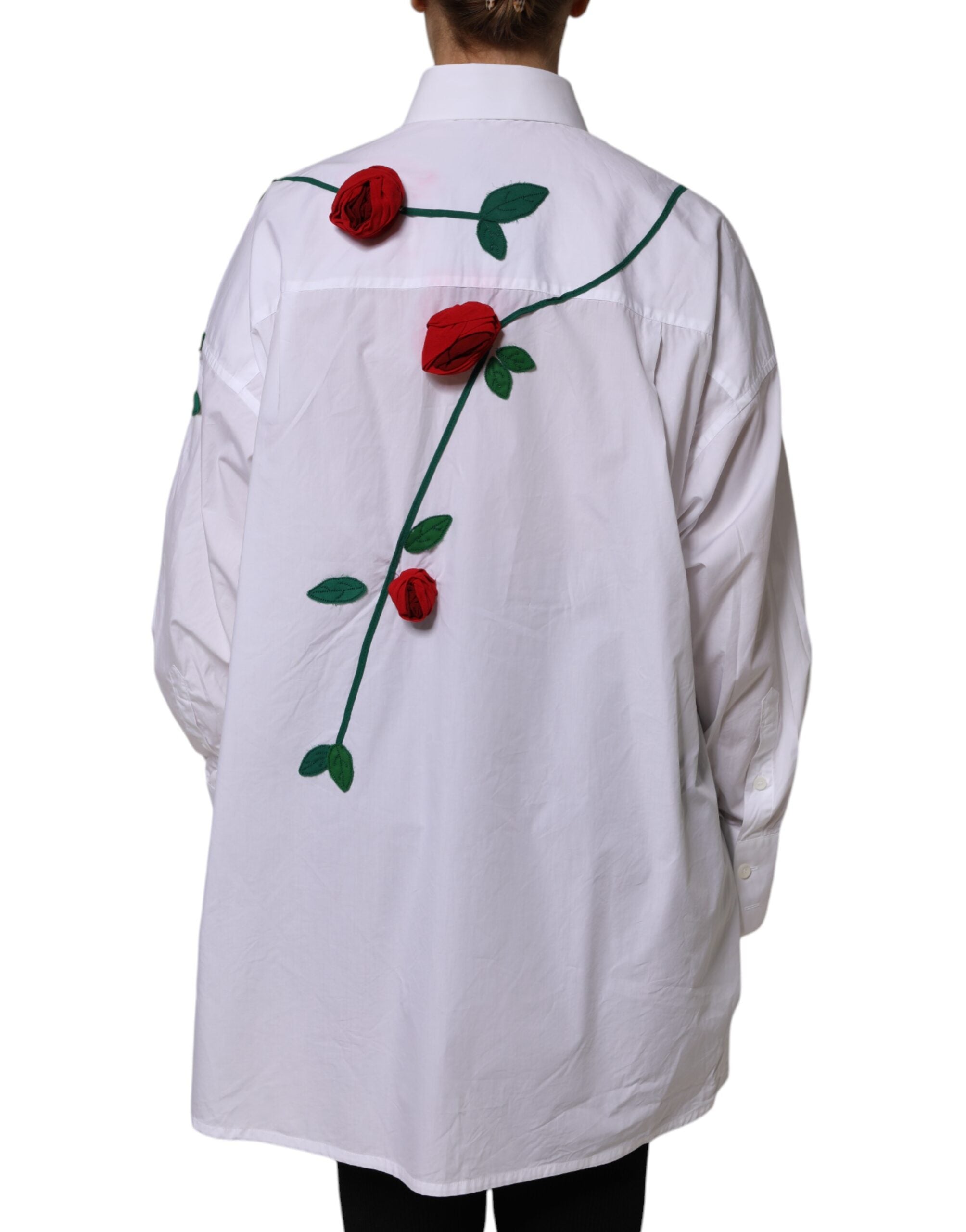 Chemise blanche Dolce & Gabbana en coton avec appliques florales, haut élégant et sophistiqué, détails visibles sur l'image.