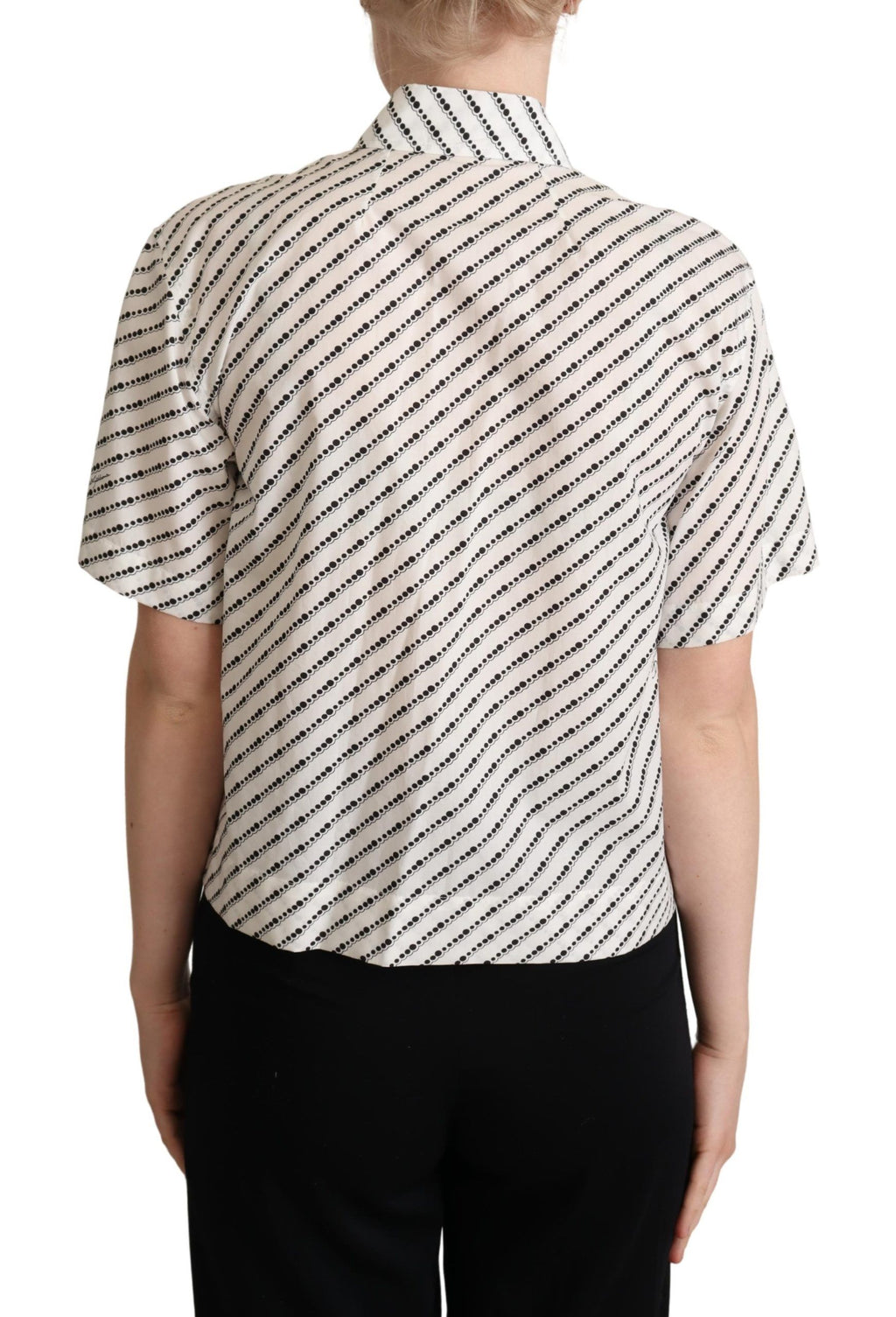 Chemise blanche à pois Dolce & Gabbana avec col, tissu léger et détails élégants, vue de face.