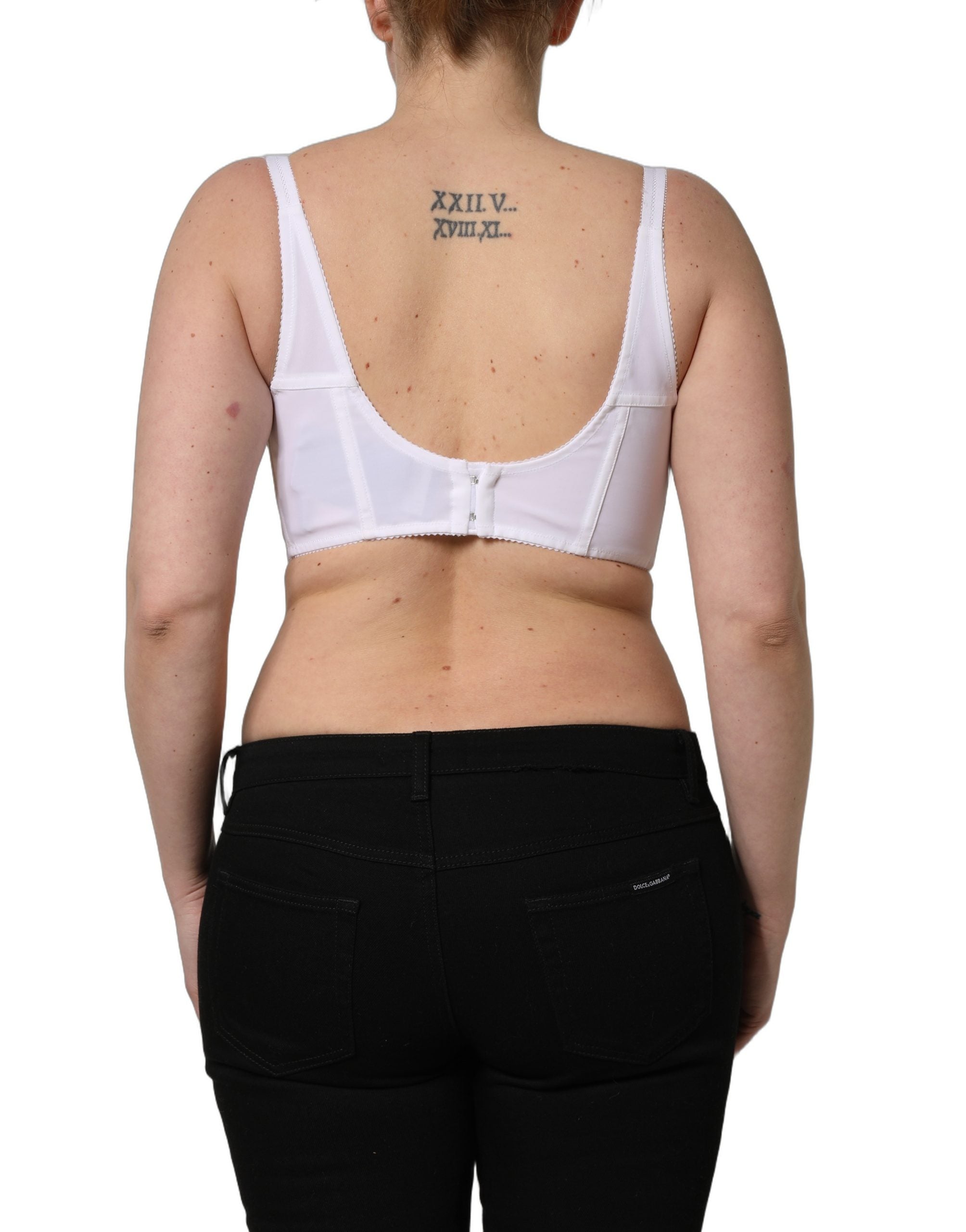 Corset bustier crop top blanc de Dolce & Gabbana avec perles, détails élégants et finition raffinée.