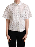 Chemise en coton blanche à pois Dolce & Gabbana avec col, élégante et légère, idéale pour un style chic et décontracté.