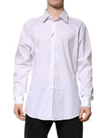 Chemise formelle Dolce & Gabbana pour homme, robe blanche à manches longues avec détails dorés élégants.