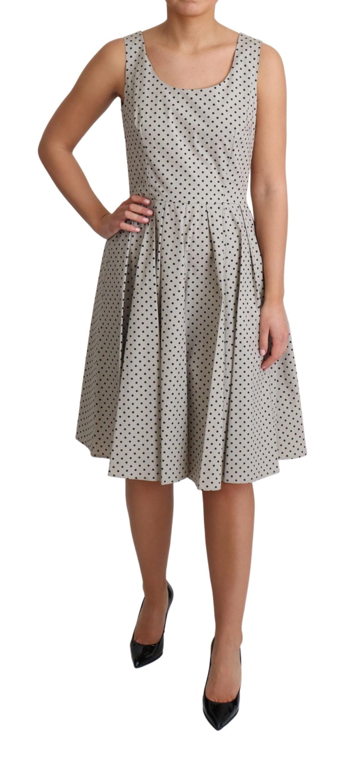 Robe trapèze en coton beige à pois de Dolce & Gabbana, style élégant avec motif à pois et coupe fluide.