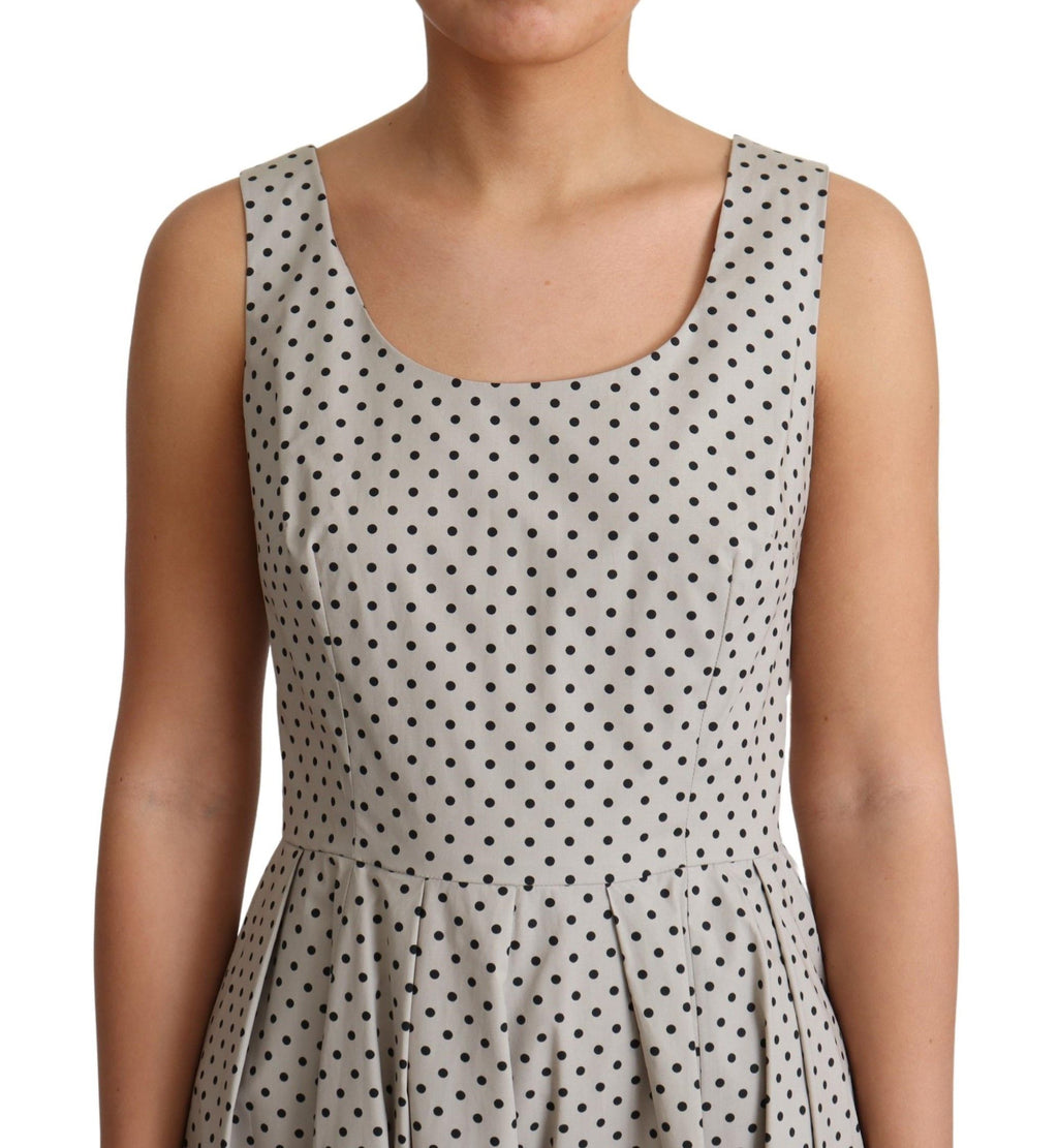 Robe trapèze en coton beige à pois Dolce & Gabbana, élégante avec un motif à pois et une coupe fluide.