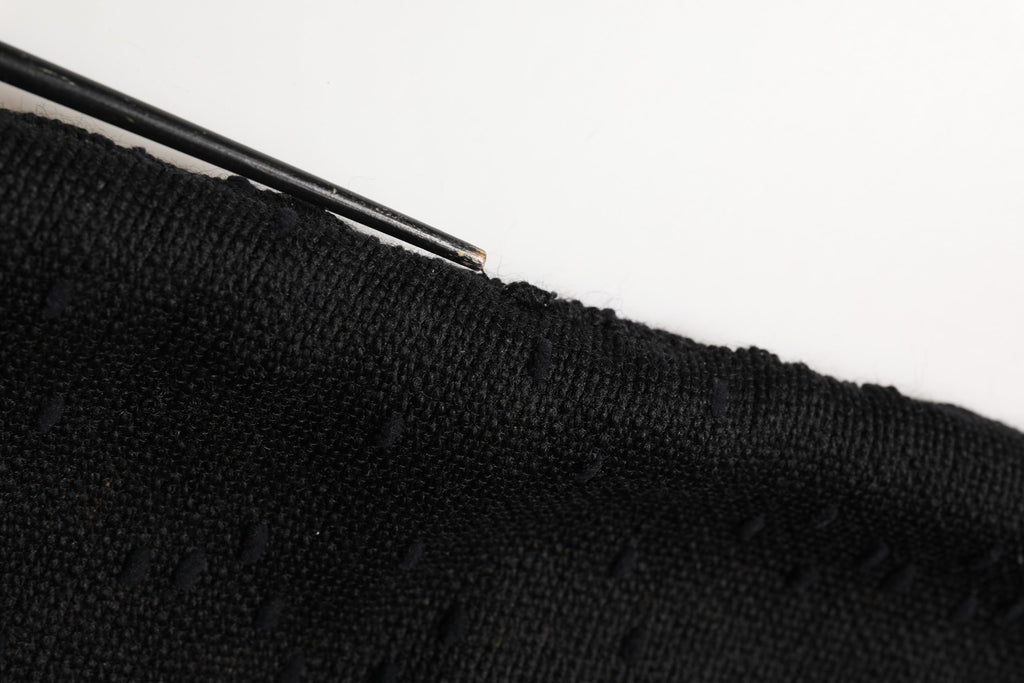 Jupe noire Dolce & Gabbana taille haute coupe crayon longueur genou, élégante et ajustée, en tissu fluide.