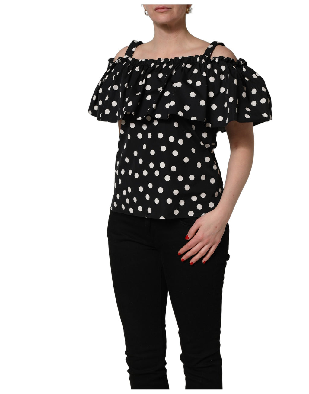 Top noir et blanc à pois encolure bardot de Dolce & Gabbana, tissu léger et style élégant, visible sur l'image.