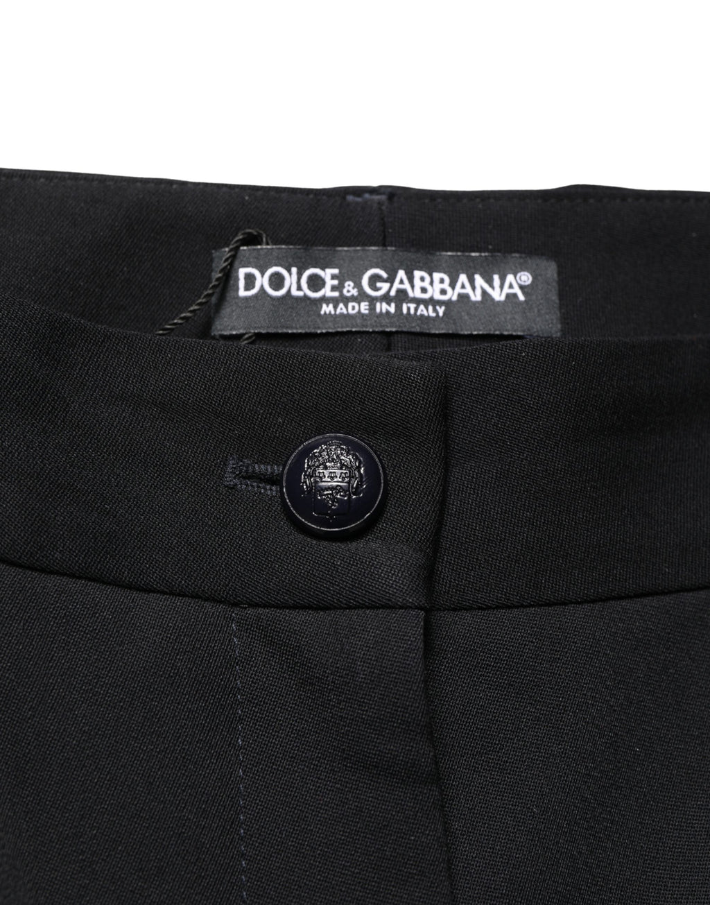 Pantalons toniques noirs en laine Dolce & Gabbana, taille haute, coupe raccourcie et tapered, détail visible sur l’image.