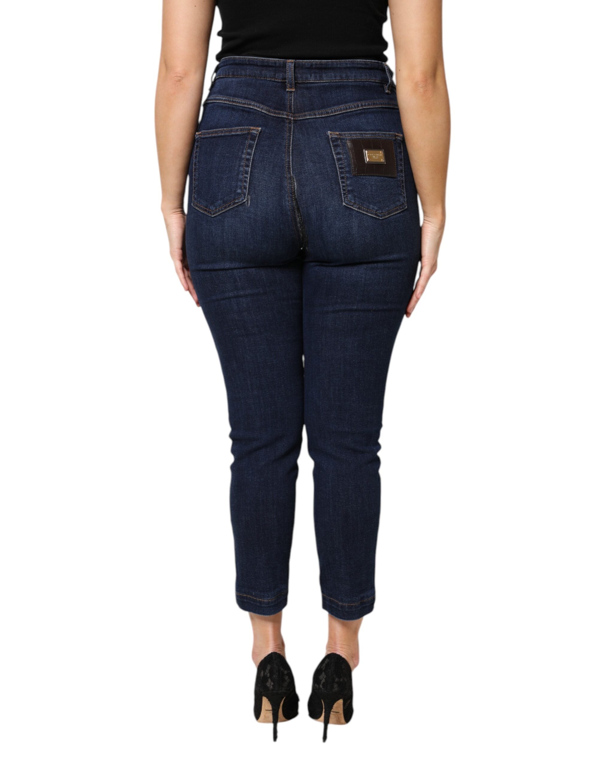 Jeans en denim bleu à taille haute Dolce & Gabbana, coupe courte en coton, visibles avec poches et détails de couture.