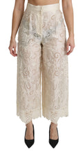 Pantalons palazzo courts en dentelle crème Dolce & Gabbana, taille haute, avec détails élégants et coupe fluide.