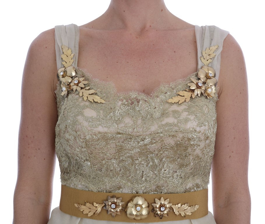 Robe en soie dorée Dolce & Gabbana ornée de cristaux, élégance sophistiquée et détails brillants visibles sur l'image.