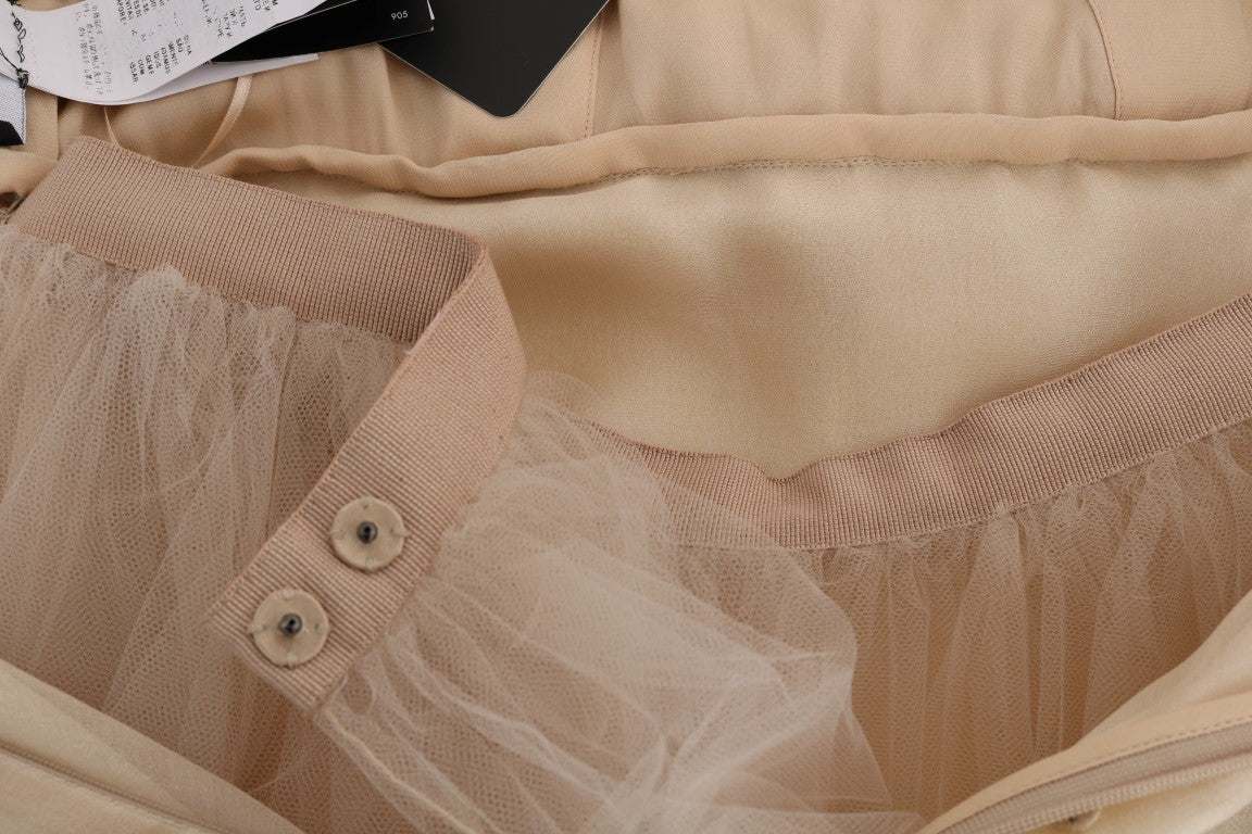 Robe en soie dorée Dolce & Gabbana ornée de cristaux, élégante et sophistiquée, vue de face sur un fond neutre.