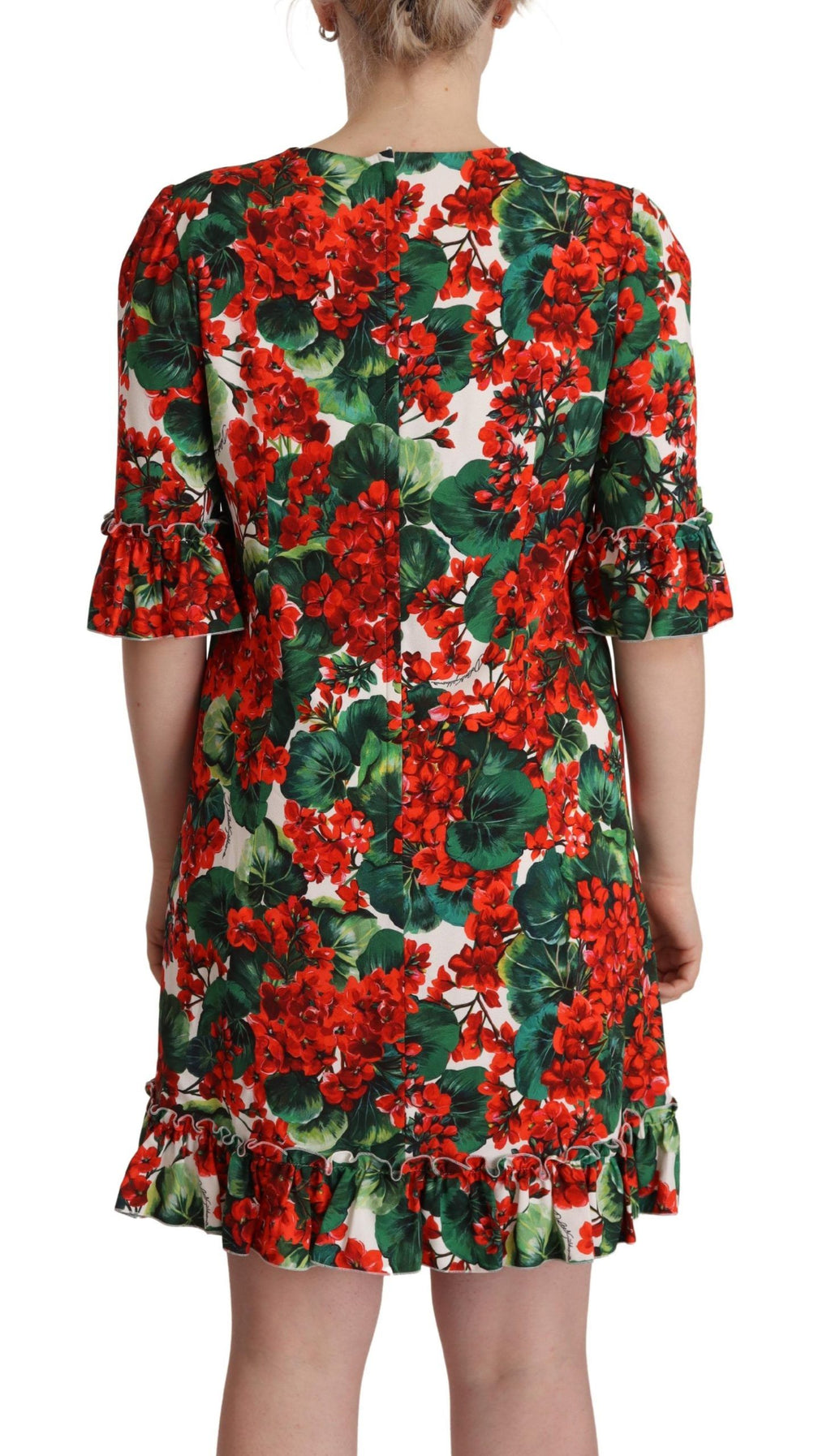 Robe de soirée Dolce & Gabbana à fleurs multicolores et rouges, coupe shift élégante, tissu fluide et détails floraux sophistiqués.