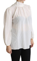 Chemise blanche en soie Dolce & Gabbana avec un nœud papillon long à manches longues, élégante et sophistiquée.