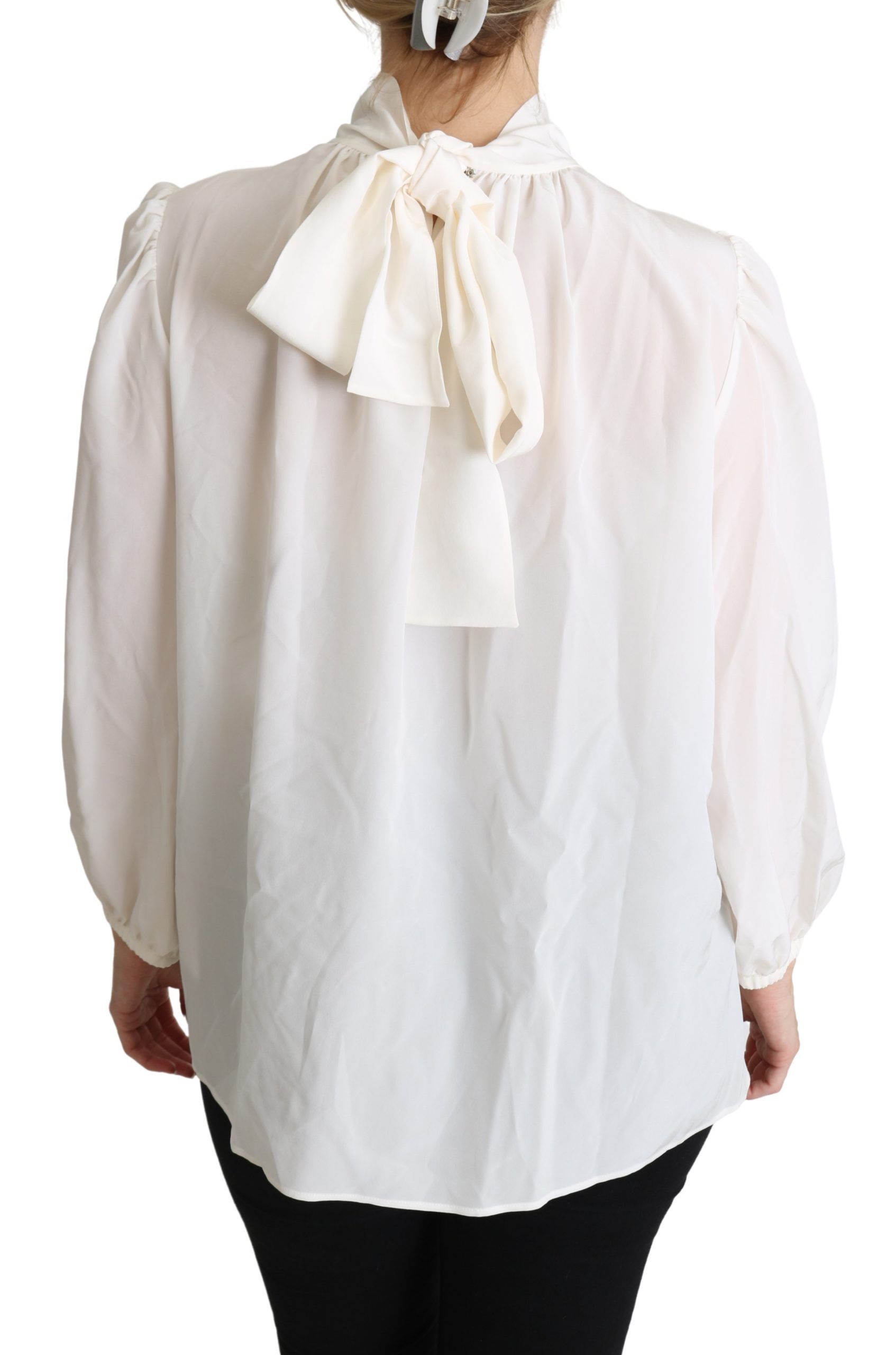 Chemise blanche en soie Dolce & Gabbana avec nœud papillon et manches longues, élégante et sophistiquée.