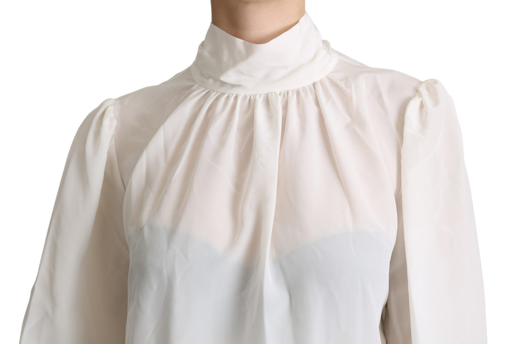 Chemise blanche en soie Dolce & Gabbana avec nœud papillon, manches longues et coupe élégante.