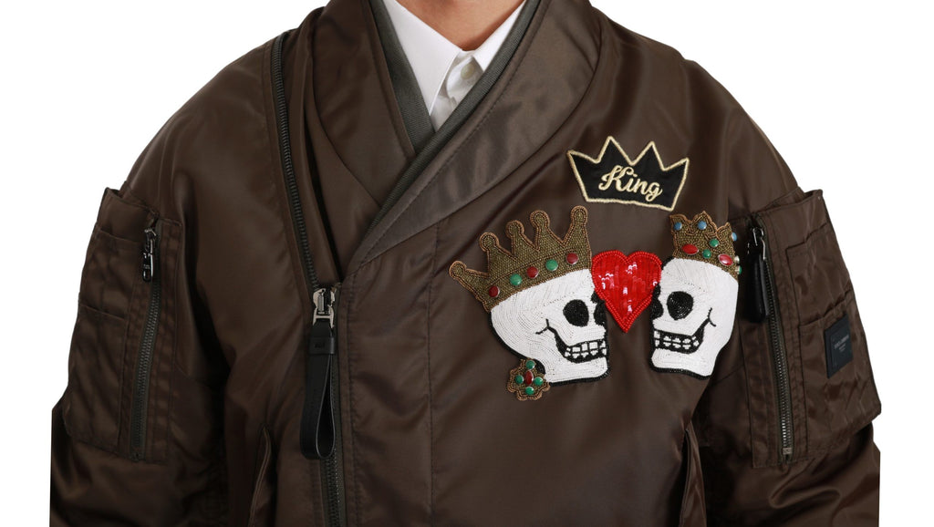 Veste Dolce & Gabbana en brun avec logo de crâne, perles et design élégant, vue de face.