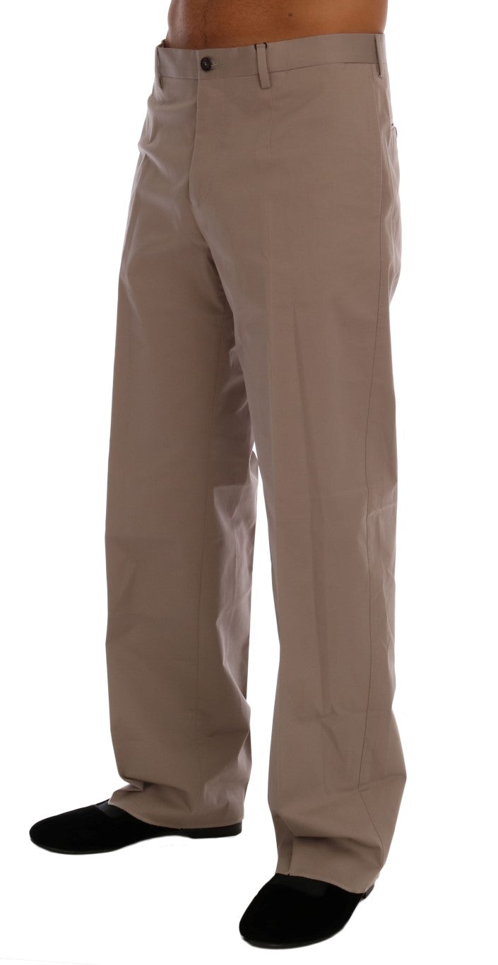 Pantalons chino en coton stretch beige Dolce & Gabbana, coupe classique et élégante, visibles en gros plan.