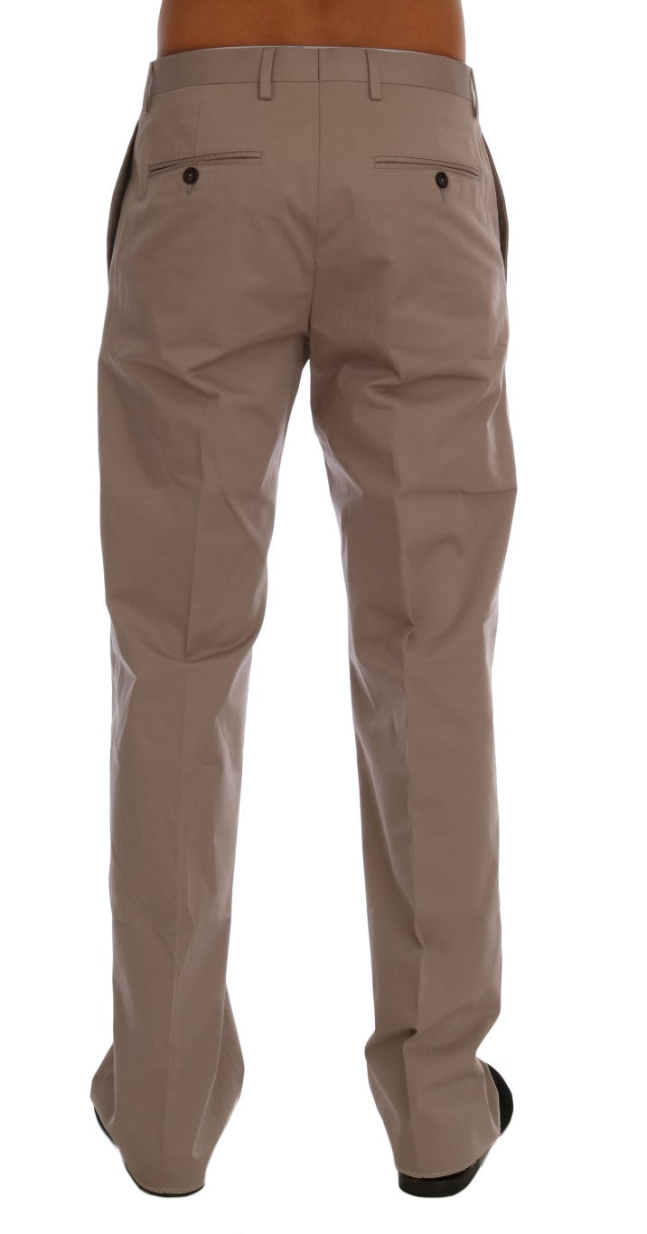 Pantalon chino en coton stretch beige de Dolce & Gabbana, coupe élégante et détails modernes.