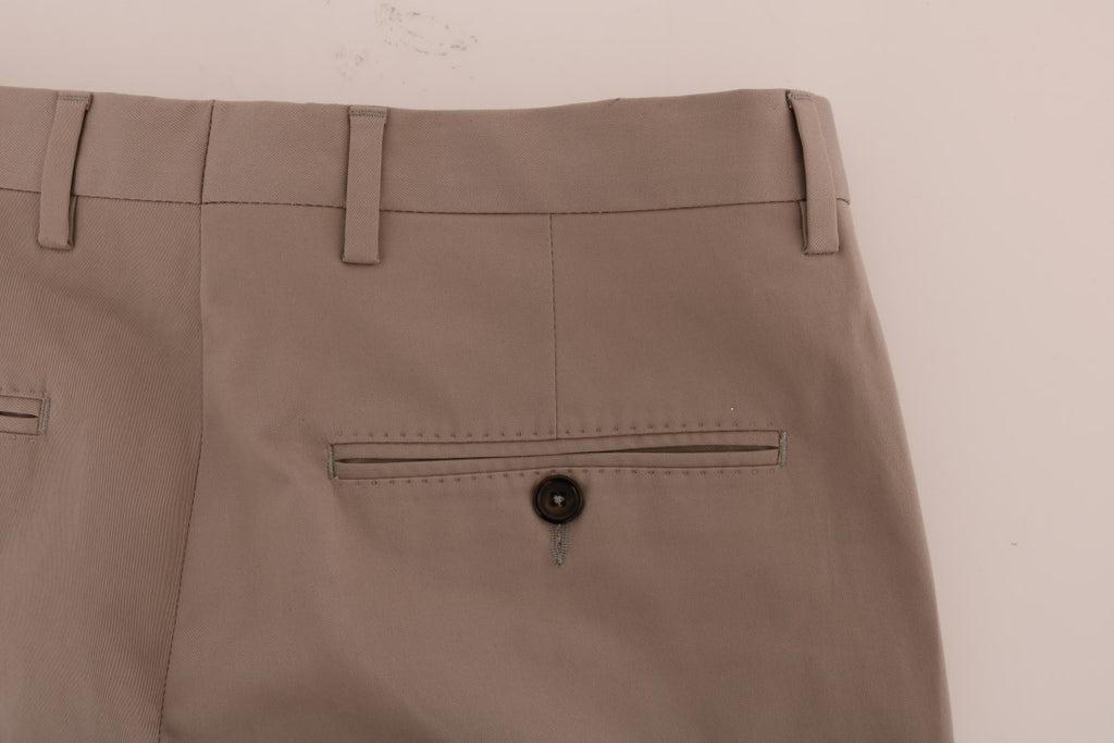 Pantalons chino en coton stretch beige de Dolce & Gabbana, coupe classique et détails élégants.