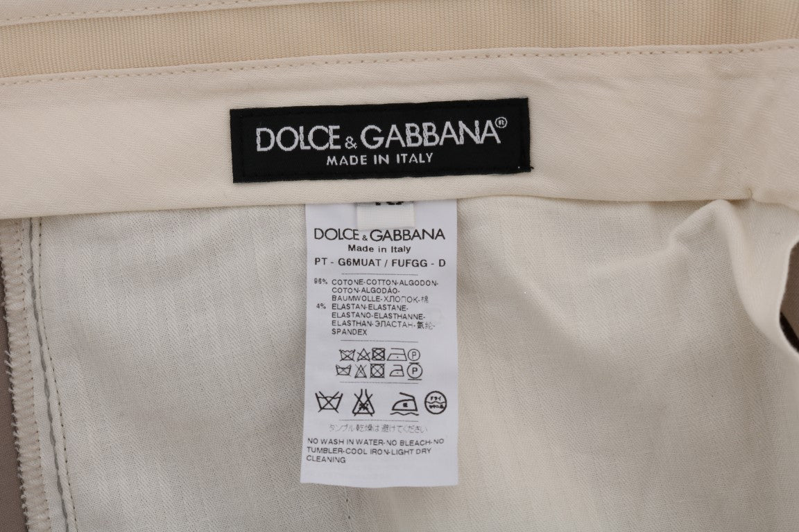 Pantalons chinos en coton stretch beige de Dolce & Gabbana, style élégant et confortable, vue de face sur un fond neutre.