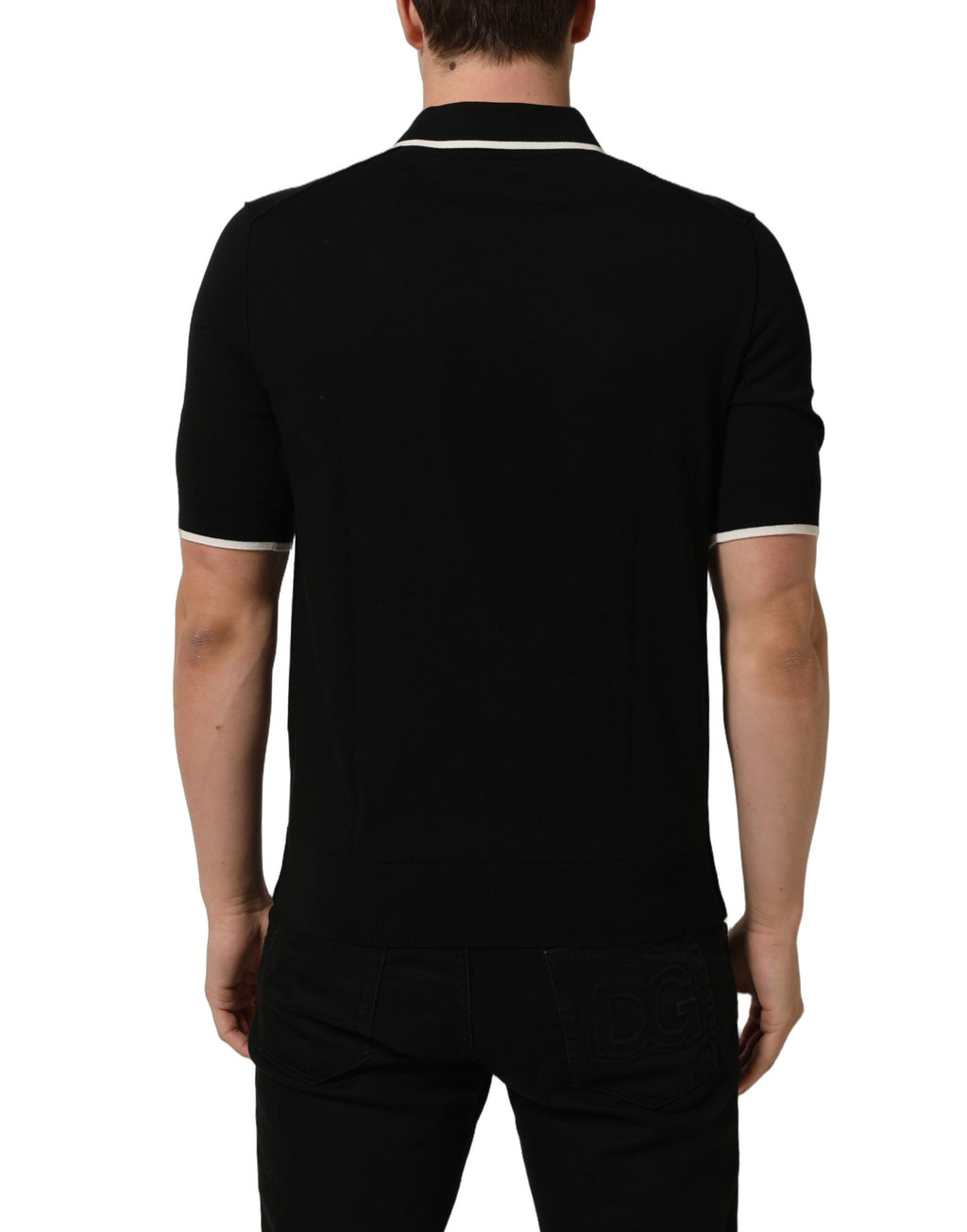 Polo Dolce & Gabbana en coton noir à col et manches courtes, vue de face.